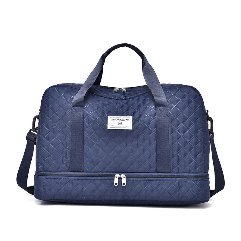 Large Oxford cloth travel bag with 36-55 litre capacity shown in haze blue colour