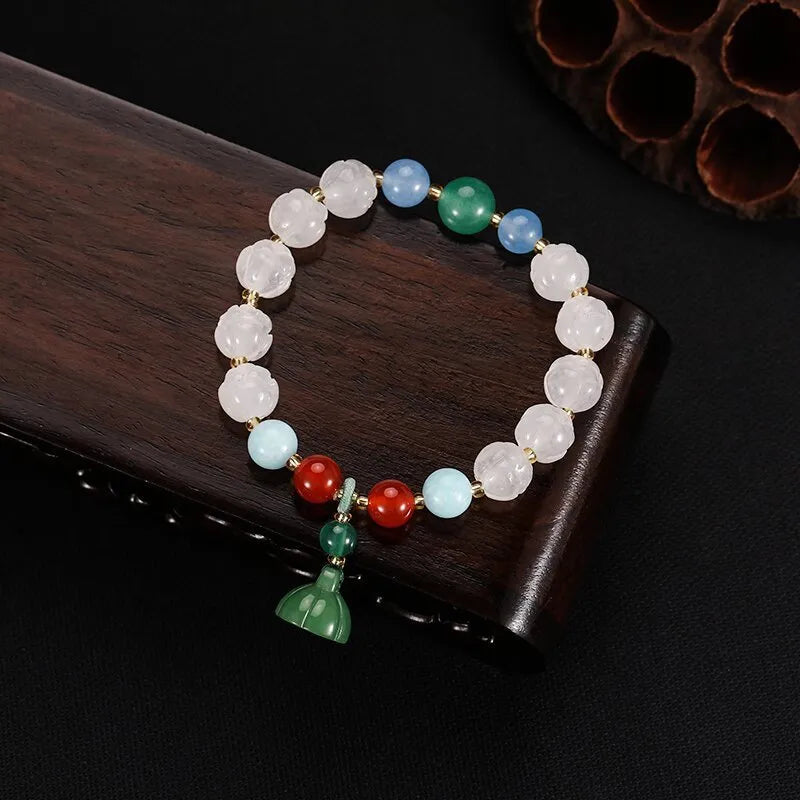 Carved pumpkin lotus bodhi root bracelet with white jade segments and golden silk jade treasures
