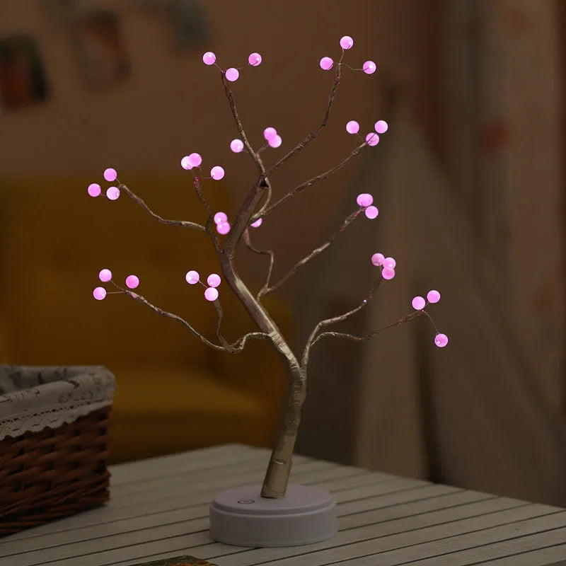 White LED Christmas tree shaped night light with touch base, standing 50cm tall on a table.