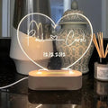 Custom transparent acrylic night light with LED base showing personalised engraving, dimensions 20cm by 11.5cm.