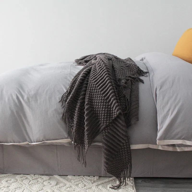 Small polyester fibre nap blanket measuring 127cm by 170cm in dark grey colour