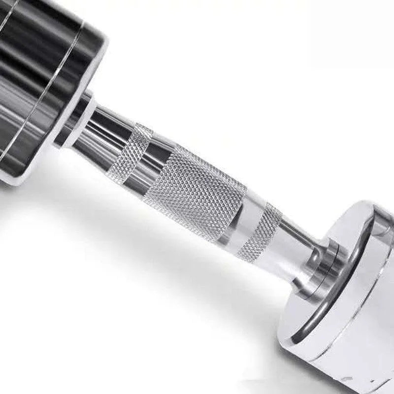 Silver pure steel dumbbell with hexagonal grip on a grey background.