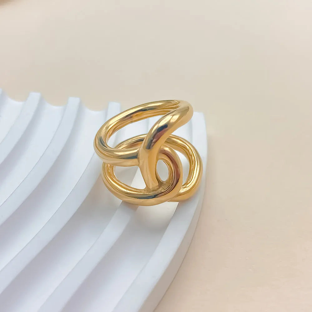 Adjustable opening ring with knotted geometric design in stainless steel gold or steel colour
