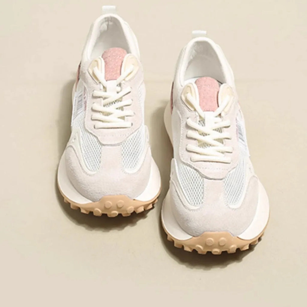 Women's grey and pink retro sneakers with mesh lining, rubber sole, and round toe design