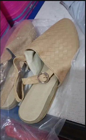 Baotou flat sandals with a buckle strap and pointed toe, shown in one of six available colours.