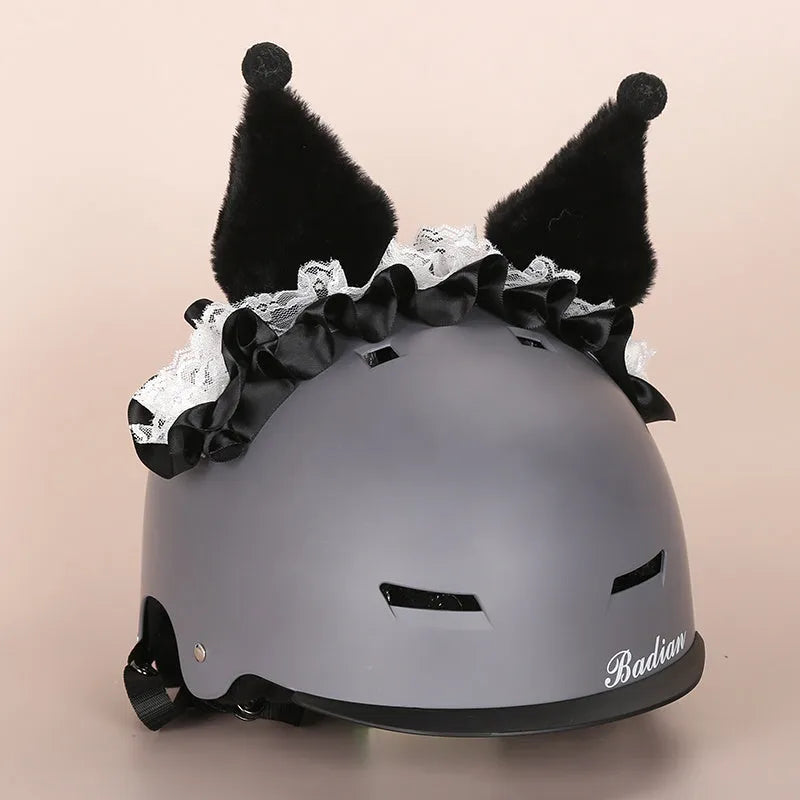 Plush fabric ski helmet decoration with cartoon design on a black ski helmet.