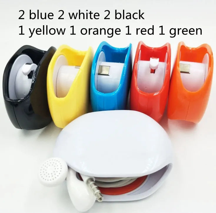 Automatic push-button earphone cable winder reel in assorted colours on a white background.