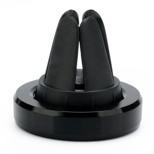 Magnetic car air vent phone holder in black mounted on vehicle vent with smartphone attached