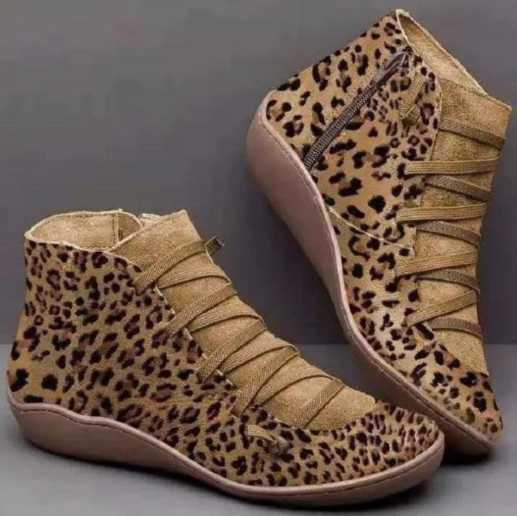 Women's flat casual booties with wedge heel and round toe in multiple colour options.