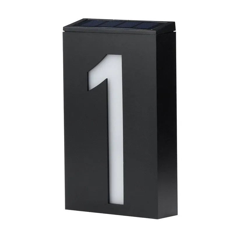 Solar-powered white LED house number light mounted on an outdoor wall