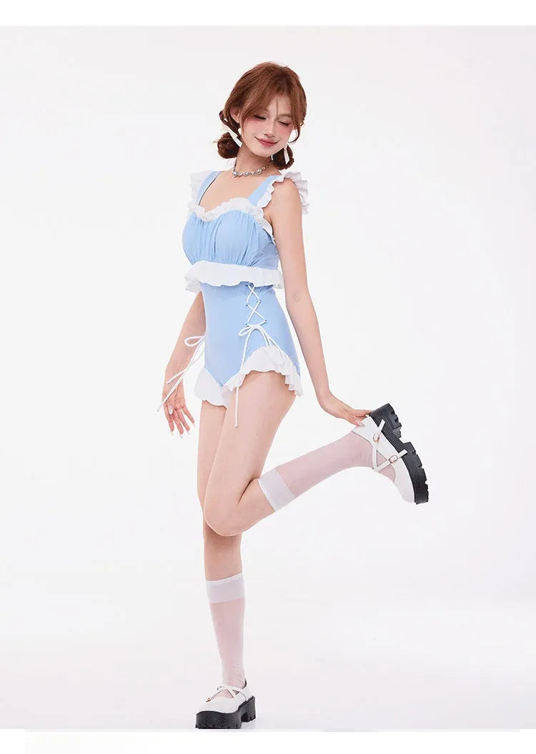Light blue high-waist, backless one-piece swimsuit with small chest gather detail.