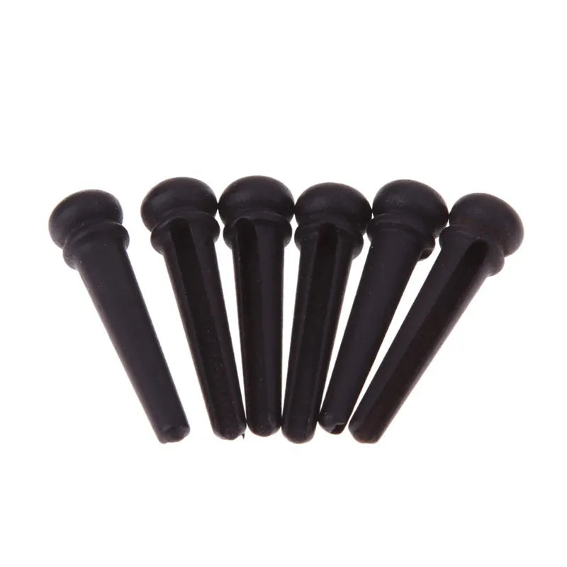 Six ebony folk guitar string nails with matt black finish for acoustic guitar bridge