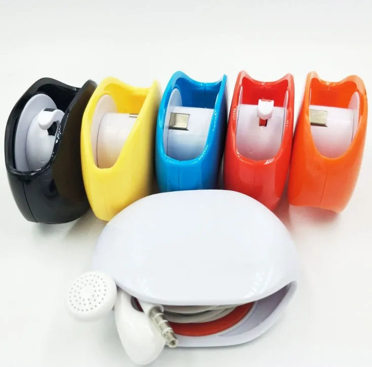 Automatic push-button earphone cable winder reel in assorted colours on a white background.