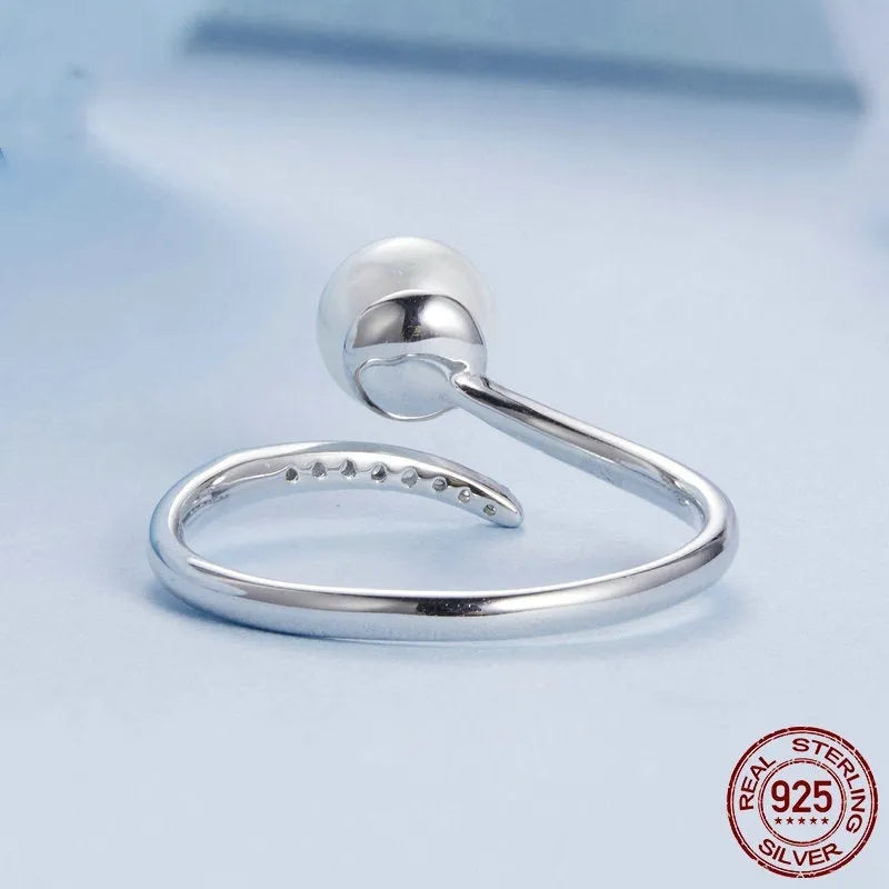 Women's S925 sterling silver adjustable ring with pearl detail and open loop design