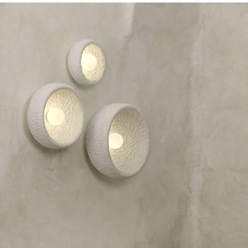 Japanese-style minimalist wall lamp with resin shade in three diameter options on modern interior wall