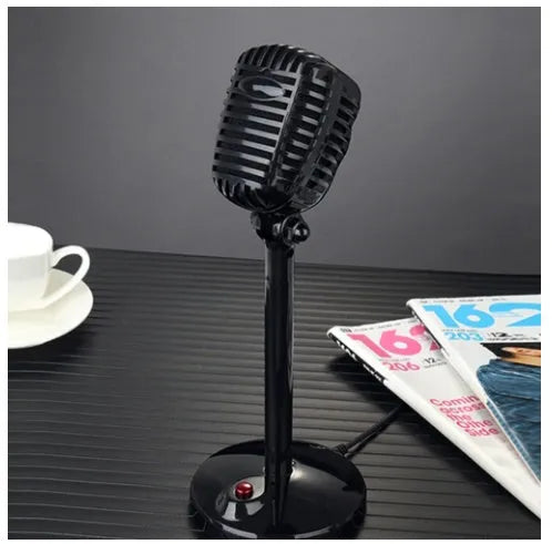 Black USB computer microphone with adjustable stand on desktop for recording