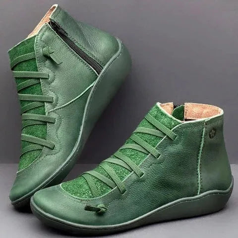 Women's flat casual booties with wedge heel and round toe in multiple colour options.