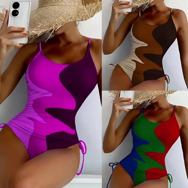 Women's sleeveless backless one-piece swimsuit in a striped pattern, shown in blue.
