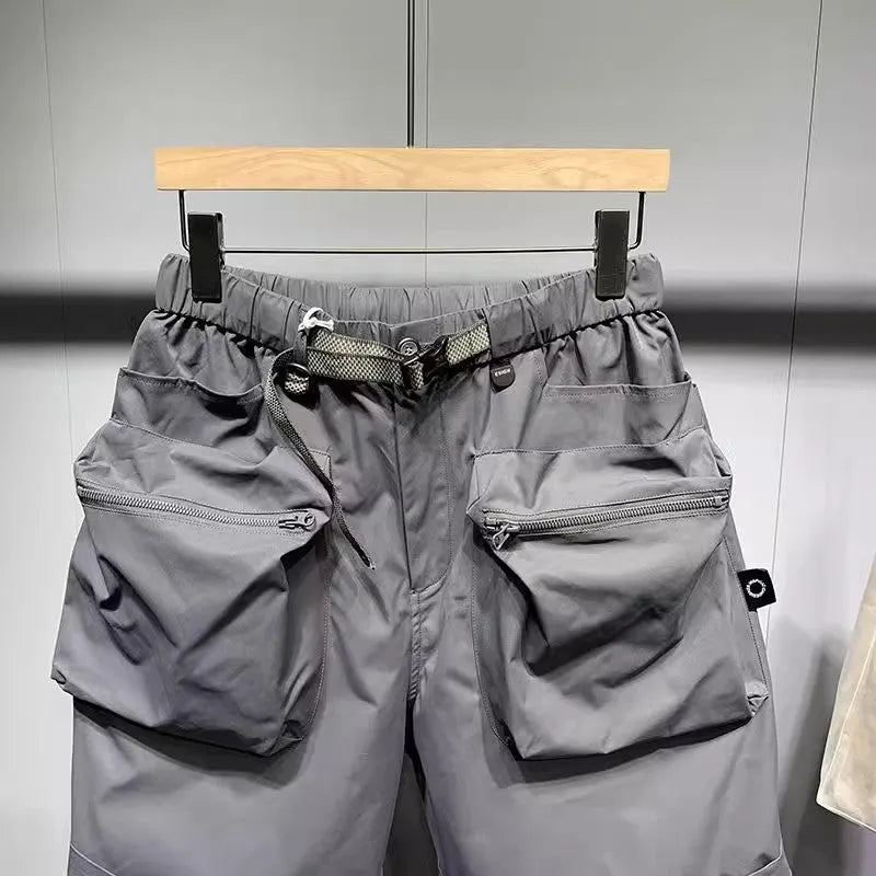 Men's black loose fitting work shorts with multiple pockets and straight leg hem
