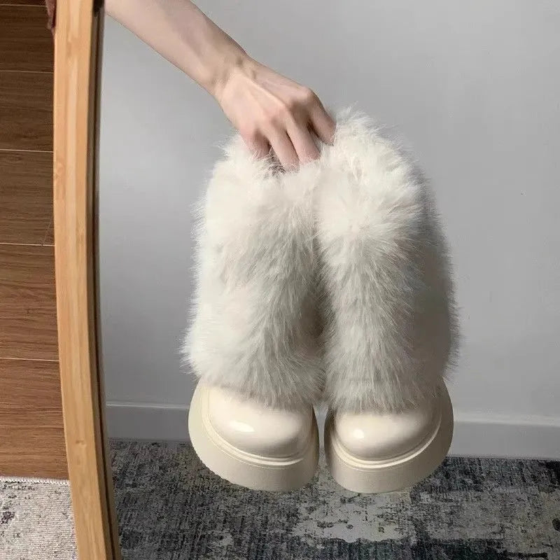 Women's black artificial plush snow boots with a round toe, low-top design, and a mid rubber sole.