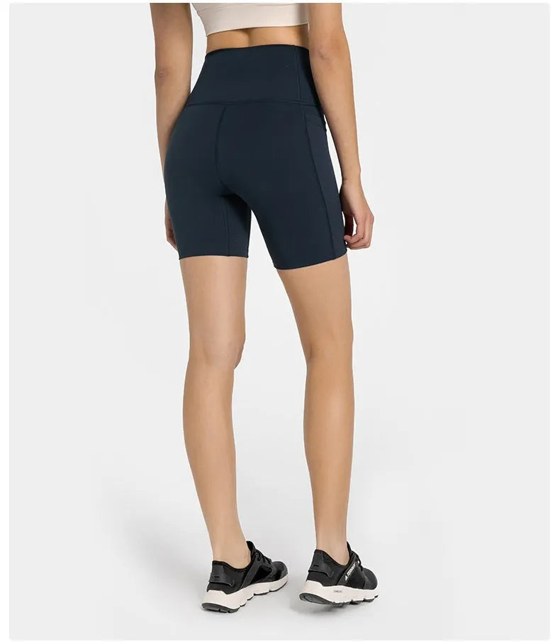 Women's tight-fitting mid-length sport shorts in black cotton blend fabric.