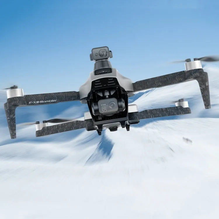White folding quadcopter drone with camera and propeller guards on a remote control.