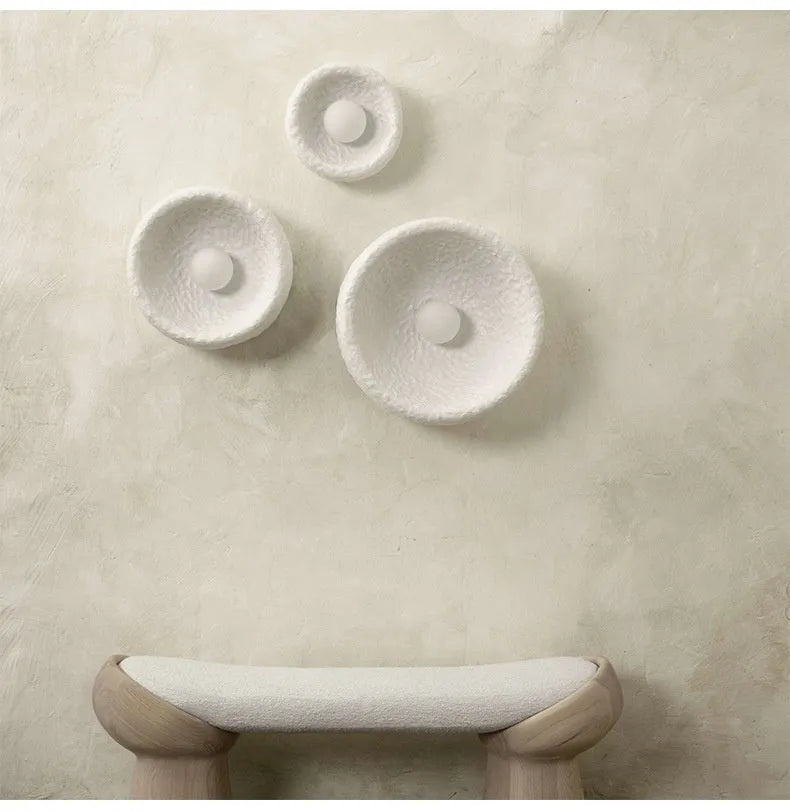 Japanese-style minimalist wall lamp with resin shade in three diameter options on modern interior wall