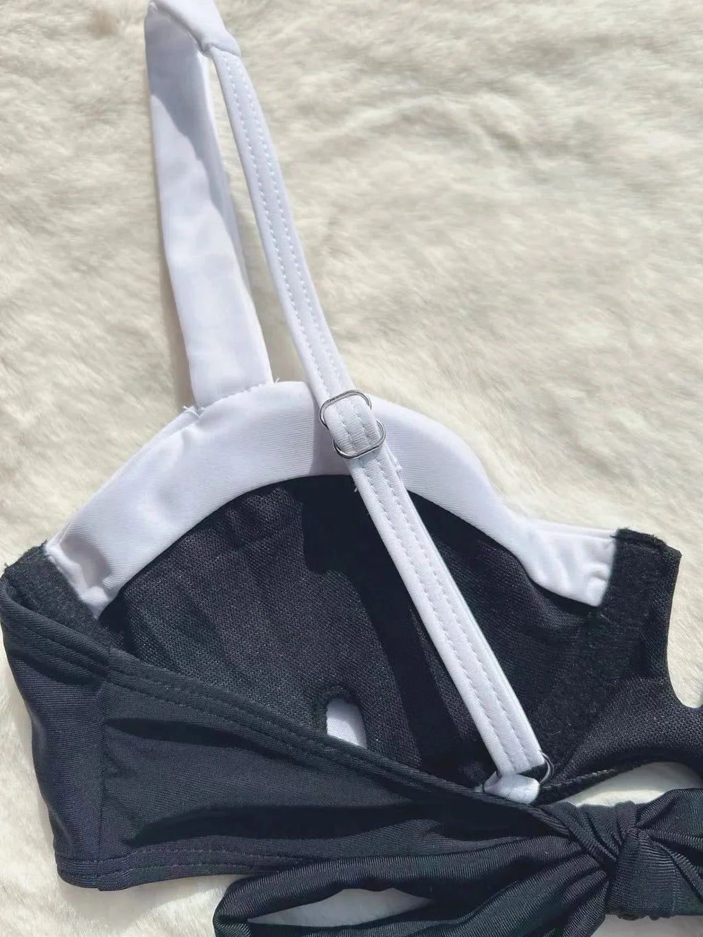 Black low waist women's bikini swimsuit with stitching split detail on the briefs