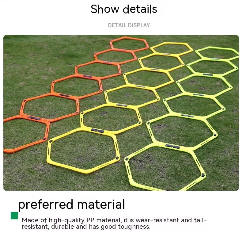 Set of six foldable yellow green and orange hexagon football agility training rings on grass.