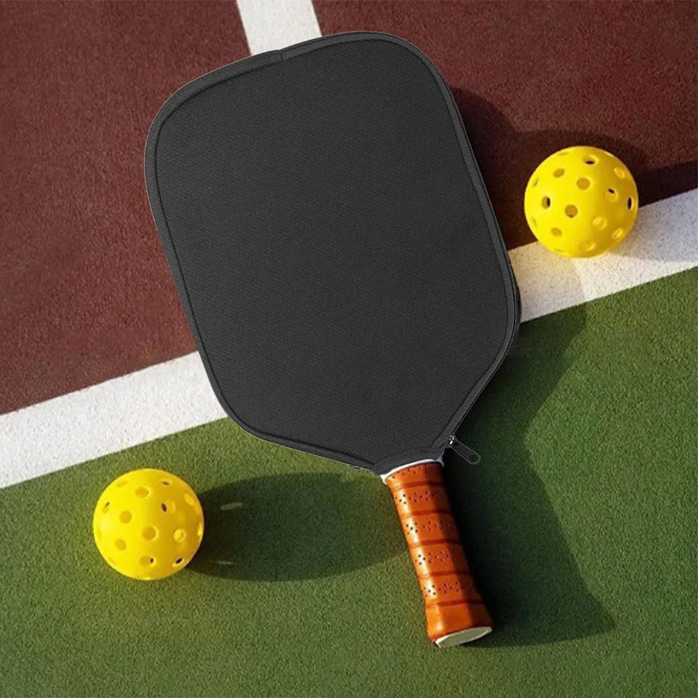 Black neoprene protective sleeve for table tennis racket on a table tennis table