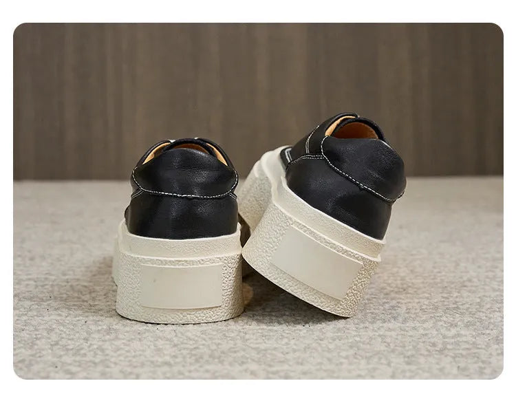 Women's black and white platform casual sports shoes with cowhide leather upper and round toe.