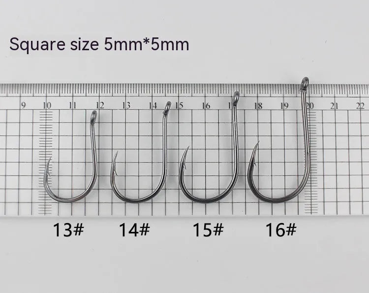 Bulk pack of barbed fishing hooks with crooked mouth and hole ring in alloy carbon steel.