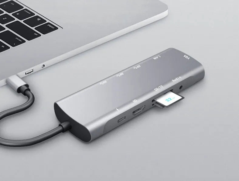 Grey USB-C docking station with HDMI, VGA, USB 3.0 and charging ports