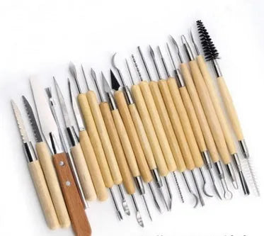 27-piece pottery clay tool set containing stainless steel, wood, and plastic tools for sculpture work