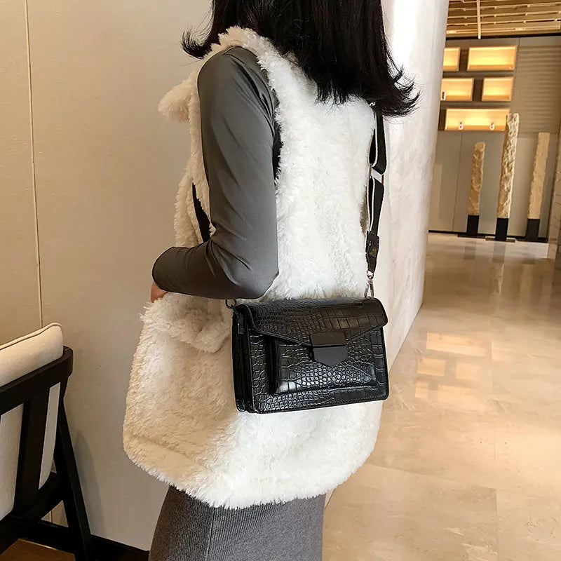 Vintage PU crossbody bag in black, shown with adjustable strap and open to reveal polyester lining.