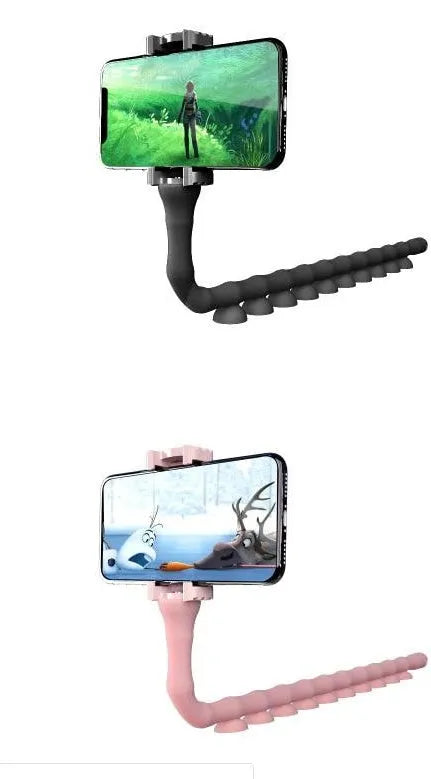 Flexible rubber phone holder with suction cup mounted on desktop showing 360-degree rotation