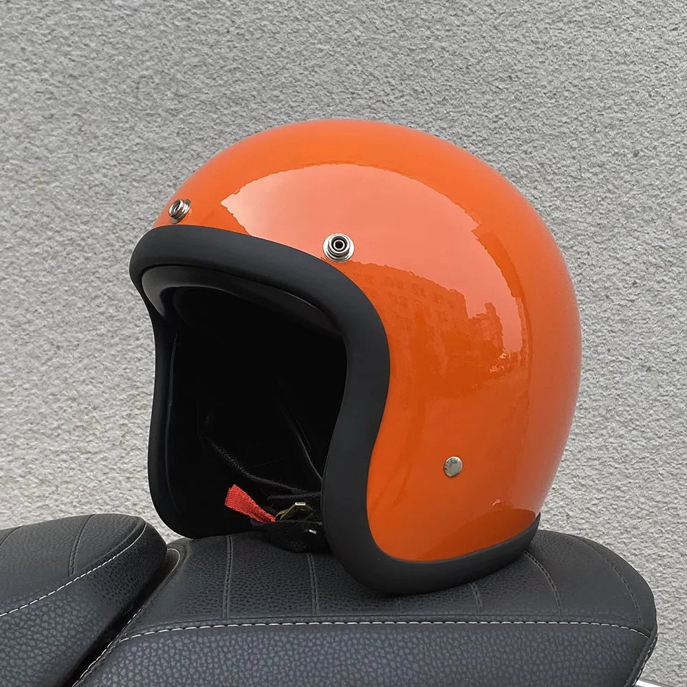 Glass fibre retro half motorcycle helmet shown in multiple colour options including cement grey and matte black flower patterns