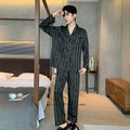 Black striped ice silk men's pajama set with long sleeve V-neck top and thin trousers.