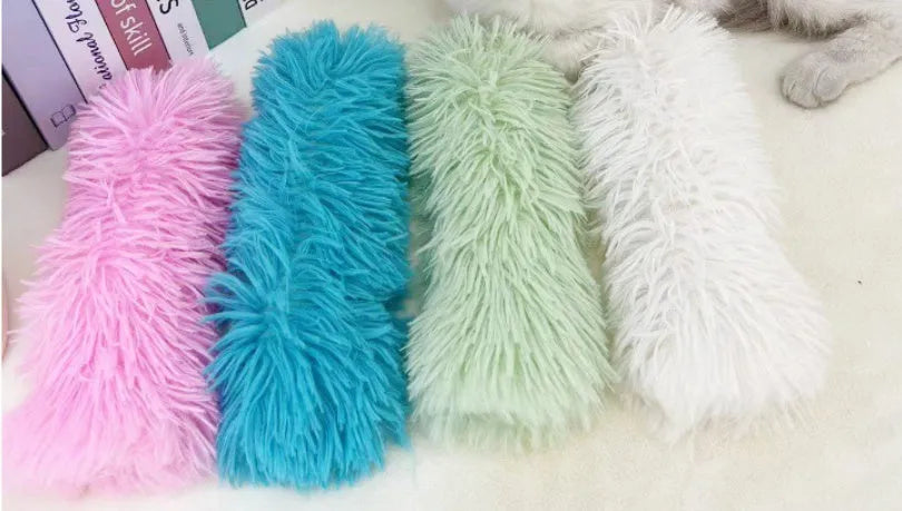 Soft plush cat toy pillow in blue, green, pink, or white, measuring 27cm by 10cm.