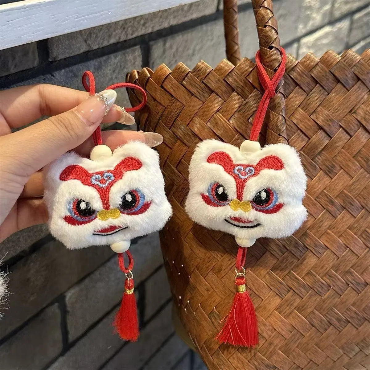 Blue and yellow handmade Chinese plush lion keychain ornament with star stone and long tassel.