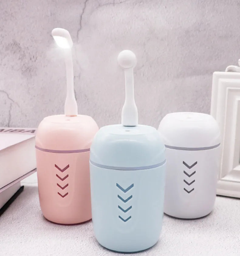 Portable columnar car humidifier with mechanical controls and USB cable in blue colour