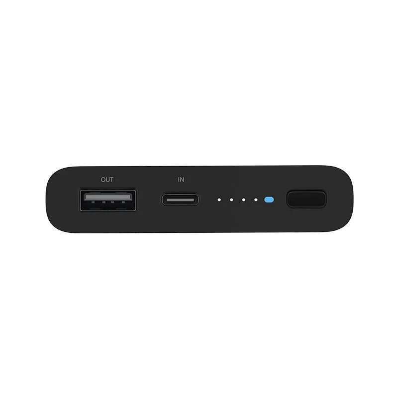 White large capacity 10000mAh power bank with USB port on a wooden table