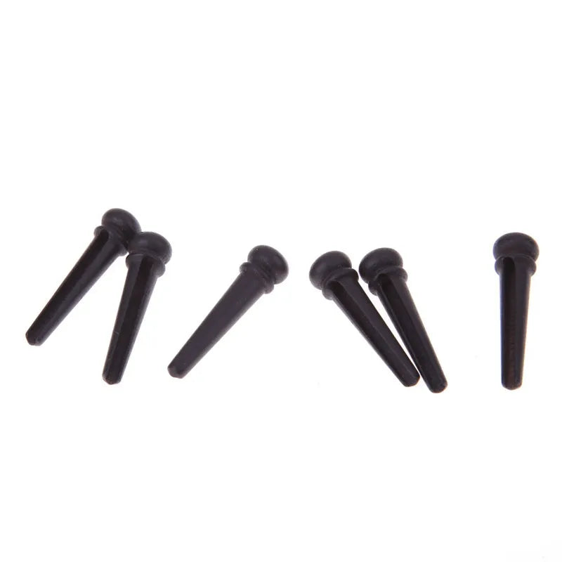 Six ebony folk guitar string nails with matt black finish for acoustic guitar bridge