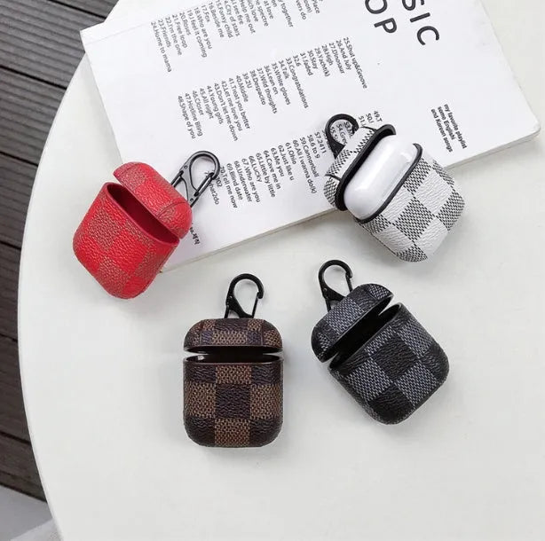 IPhone XS Max hard plastic case with grid pattern and anti-lost hook, next to a compatible AirPods 2 leather charging case.