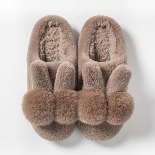 Women's fluffy bunny slippers in pink with rabbit fur, high-top sleeve design, and sewn sole.