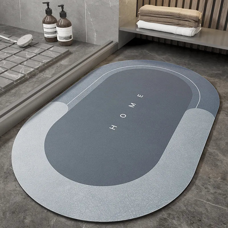 Soft blue oval bathroom floor mat placed on tiles beside a bathtub.