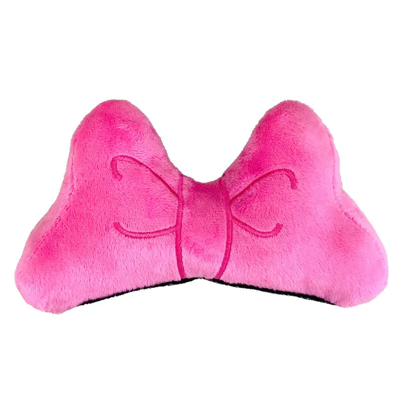Plush bow tie helmet decoration for motorcycle and ski helmets in red, peach pink, and rose pink colours.