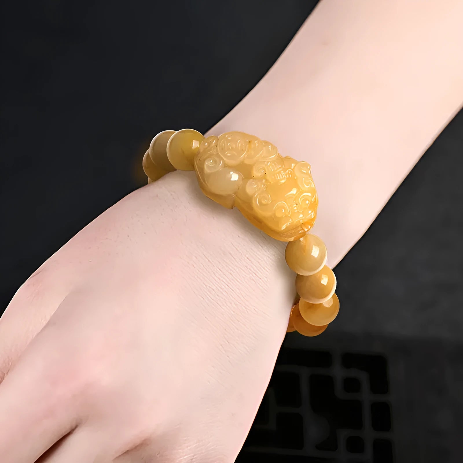 Golden thread Jinsi Jade money bracelet with carving details shown in two size variations