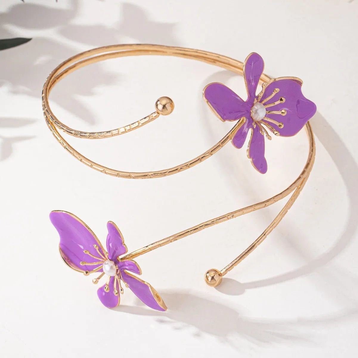 Pink alloy armband with hollow pattern design showing adjustable sizing and cut-out details