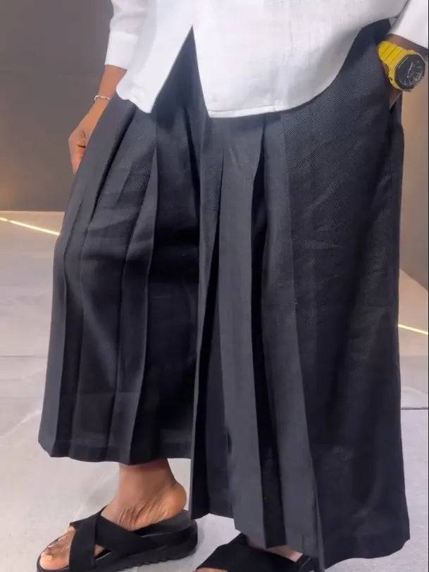 Women's white asymmetric front long sleeve shirt and black pleated trousers casual set